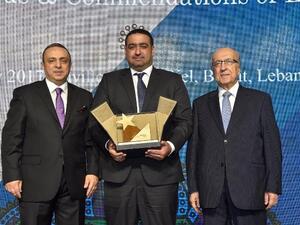 Talib receives the Award from Fattouh and WUAB Chairman, Dr. Joseph Torbey.