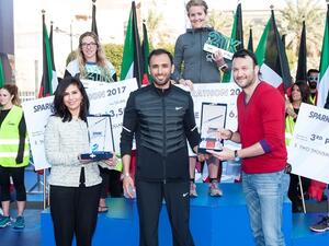 Loulwa Al-Ayoubi – Senior External Affairs Manager, Burgan Bank & Abdulmohsen Al-Babtain, Head of Spark Marathon Organizing committee giving awards to winners