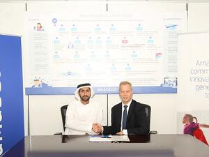 جراهام نيكولاس، مدير عام أماديوس الخليج وعبدالله بن عمير، الرئيس التنفيذي لوكالة عمير للسفريات