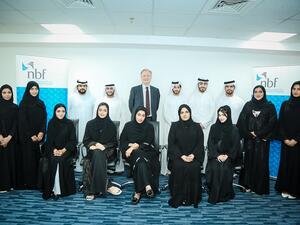 Picture of Vince Cook alongside the latest batch of the Management Training Programme participants