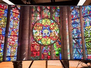 The QLED TV has an even slimmer nearly-there bezel, slim premium metal body, and clean back. 