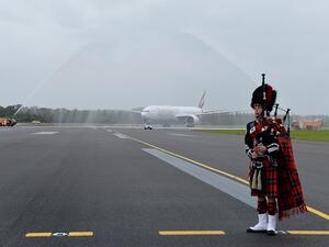 Emirates is welcomed to Edinburgh Airport with a water cannon salute and a bagpiper. 
