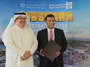 Mr. Khalid Rafea with the winner Mr. Adel Sarea