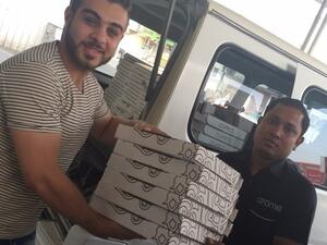 Zain Bahrain Distributing food before Futoor