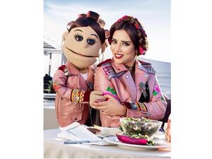 Egyptian puppet character Abla Fahita and the famous singer Balqees