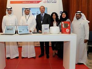 Mr. Omar Kutayba Alghanim, Chairman of Gulf Bank among members of senior management at the bank’s booth 