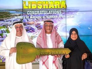 Khalid Rafea, Executive Manager and Head of Retail Banking Group at KFH-Bahrain with the winner Ebrahim Bukhamas.