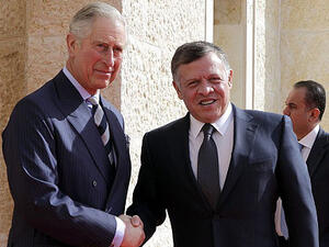 King Abdullah II greets the Prince of Wales outside Al Husseiniya Palace. (AFP/File)
