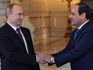 Egyptian President Abdel-Fattah el-Sisi shakes hands with his Russian counterpart Vladimir Putin during their meeting in Cairo on February 10. (AFP)