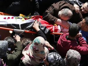 Palestinian mourners attend the funeral of Eyad Omar Sajdia, 22, who was killed during clashes with Israeli security forces at the Qalandya Refugee camp on March 1, 2016 in the Israeli-occupied West Bank. (AFP/Abbas Momani)