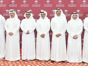 Qatar Football Association president HE Sheikh Hamad bin Khalifa bin Ahmed al-Thani (centre) poses with other officials after being re-elected for another four-year term at the General Assembly of the body yesterday. (Photo: Gulf Times)