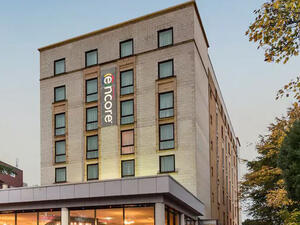 Ramada Encore, a three-star hotel offering 140 deluxe rooms and 24 suites.