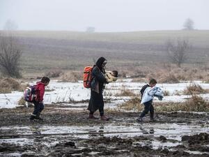 Migrants and refugees walk after crossing the Macedonian border into Serbia. (AFP/File)