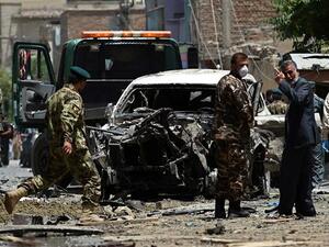 Afghan security forces inspect a damaged vehicle at the site of a bombing in the capital. (AFP/File) Afghan security forces inspect a damaged vehicle at the site of a bombing in the capital. (AFP/File)