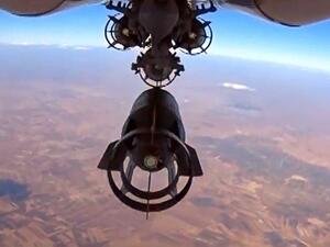 A video grab made on Oct. 6, 2015, shows an image taken from footage made available on the Russian Defense Ministry's official website on Oct. 5, purporting to show a Russia's Su-24M bomber dropping bombs during an airstrike in Syria. (Russian Defence Ministry/AFP/Getty Images)