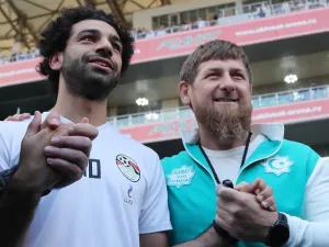 Egyptian national football team player and Liverpool's star striker Mohamed Salah (L) poses with head of the Chechen Republic Ramzan Kadyrov during a training at the Akhmat Arena stadium in Grozny on June 10, 2018, ahead of the Russia 2018 World Cup. Egypt's national football team will use the venue as their base camp training site.
KARIM JAAFAR / AFP