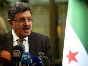 High Negotiations Committee (HNC) spokesman Salem al-Meslet speaks during a press conference on the eve of the second round of Syrian peace talks in Geneva on March 13, 2016. (AFP/Philippe Desmazes)