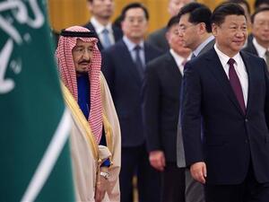 Chinese President Xi Jinping (R) welcomes visiting Saudi King Salman in Beijing on March 16, 2017. (AFP)