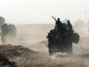 Shia fighters from the Popular Mobilization Forces arrive south of Mosul as part of the largest military operation in Iraq in years. (AFP/File)
