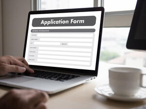 Man applying for a job online. (Shutterstock/ File Photo)
