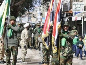 عرض عسكري لفصيل شيعي عراقي في قلب دمشق