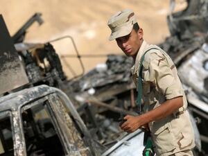 An Egyptian soldier stands guard in an ongoing military operation against militants in the restive Sinai Peninsula (AFP/File Photo)