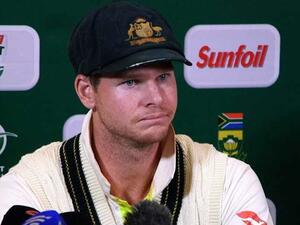 Steve Smith, Australia's captain, fields questions from reporters after admitting to ball tampering (AFP)