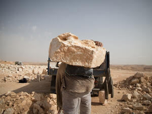 The profession of “stone mover”, first began in the seventies, involves the moving, by hand, of medium-sized stones from the quarries to trucks, prior to their transport to stone crushing plants where they are broken down for sale. (http://www.hussamd.me/)

