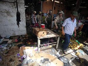Iraqi security forces gather at the site of a suicide bombing in northern Baghdad on May 17, 2016. (AFP/Ahmad Al-Rubaye) Iraqi security forces gather at the site of a suicide bombing in northern Baghdad on May 17, 2016. (AFP/Ahmad Al-Rubaye)