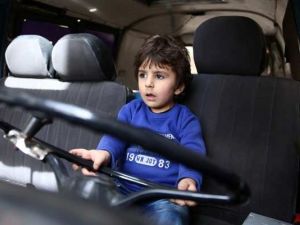 A boy plays in a vehicle (AFP/File Photo)