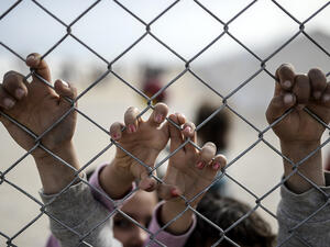 Syrian children await aid at a refugee camp in Turkey on February 2, 2015.  (AFP/Bulent Kilic)