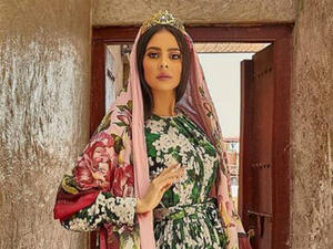 The blogger modeled in Dubai’s Old Souk and wore a long-length dress printed with clutches of white flowers (Source: tamaraalgabbani - Instagram)