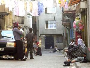Clean laundry dries on lines stretched from house to house above residents of Istanbul's Tarlabasi neighborhood.  (AFP/Mustafa Ozer)