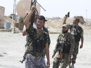 مقاتلون شيعة في مدينة طوزخورماتو بالعراق
