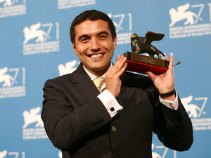 Director Naji Abu Nowar poses with his Orizzonti award for Best Director for his movie 'Theeb' during the award winners photocall of the 71st Venice Film Festival on September 6, 2014 in Venice, Italy. (Zimbio.com)