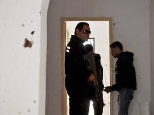 Tunisian gendarmes walk inside a house where two suspected jihadists were killed during a security operation on May 11, 2016 in the town of Mnihla, in Ariana province just outside Tunis. (AFP/Fethi Belaid) Tunisian gendarmes walk inside a house where two suspected jihadists were killed during a security operation on May 11, 2016 in the town of Mnihla, in Ariana province just outside Tunis. (AFP/Fethi Belaid)