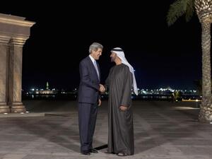 U.S. Secretary of State John Kerry speaks to Abu Dhabi's Sheikh Mohammed bin Zayed al-Nahyan before their meeting at the Emirates Palace in Abu Dhabi.[voanews]