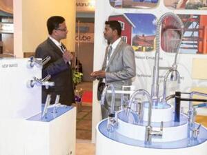 Exhibtor explaining the products of Rak Ceramics, during the Big 5 Show being held in Dubai Trade center.