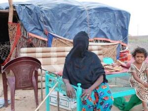 Umm Ali lives in a straw hut without electricity with her seven children 