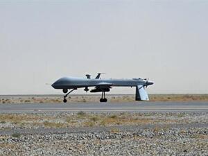 A U.S. Predator drone armed with a missile rests on the tarmac of Kandahar military airport (Photo courtesy of The Daily Star) 