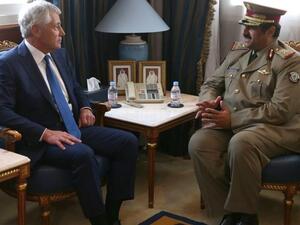 US Secretary of Defense Chuck Hagel (L) meets with Minister of Defense of Qatar, Hamid bin Ali Al-Attiyah, at the Defense Headquarters, on December 10, 2013 at Doha, Qatar. [AFP]