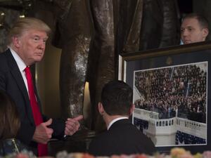US President Donald Trump gives a thumbs up in front of House Speaker Paul Ryan after being presented a photo of his inauguration during the Inaugural Luncheon following his inauguration as the 45th President of the United States, in Washington, DC, on January 20, 2017. (AFP/Molly Riley)