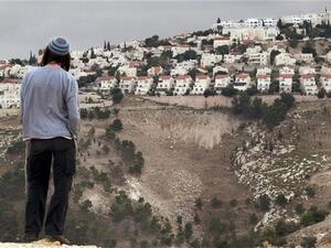 A Jewish settler looks at a West bank settlement on the outskirts of Jerusalem. (AFP/File)