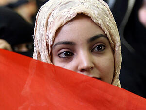 A woman attends a demonstration in Yemen's capital city Sanaa.  (AFP/File)