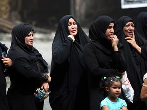 Iraqi women in mourning on July 4, 2016, outside the site of a deadly suicide bombing in Baghdad. (AFP/Ahmad Al-Rubaye) Iraqi women in mourning on July 4, 2016, outside the site of a deadly suicide bombing in Baghdad. (AFP/Ahmad Al-Rubaye)