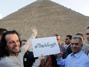Yanni poses with one of the Great Pyramids of Egypt. (File photo)