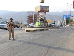 A picture taken on May 3, 2016 shows a Yemeni security forces member patrolling a street with a banner hung by Al-Qaeda militants in the Yemeni port of Mukalla, 300 miles east of Aden. (AFP/Stringer) A picture taken on May 3, 2016 shows a Yemeni security forces member patrolling a street with a banner hung by Al-Qaeda militants in the Yemeni port of Mukalla, 300 miles east of Aden. (AFP/Stringer)