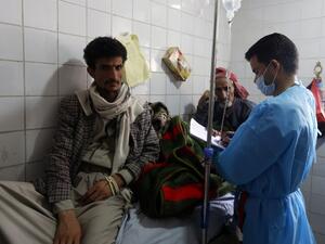 Yemeni men suspected of being infected with cholera receive treatment at a hospital in Sanaa on May 12, 2017. (AFP/Mohammed Huwais)