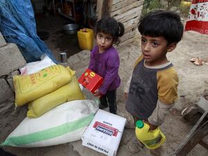 Yemeni children stand next to food rations that a local charity is distributing to families affected by the country's ongoing conflict during the fasting month of Ramadan on June 15, 2016 in an empoverished part of the capital Sanaa. (AFP/Mohammed Huwais) Yemeni children stand next to food rations that a local charity is distributing to families affected by the country's ongoing conflict during the fasting month of Ramadan on June 15, 2016 in an empoverished part of the capital Sanaa. (AFP/Mohammed Huwais)