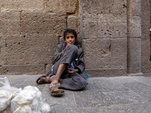 A Yemeni boy sits at a market in the old city of the capital Sanaa on October 21, 2016. (AFP/Mohammed Huwais)